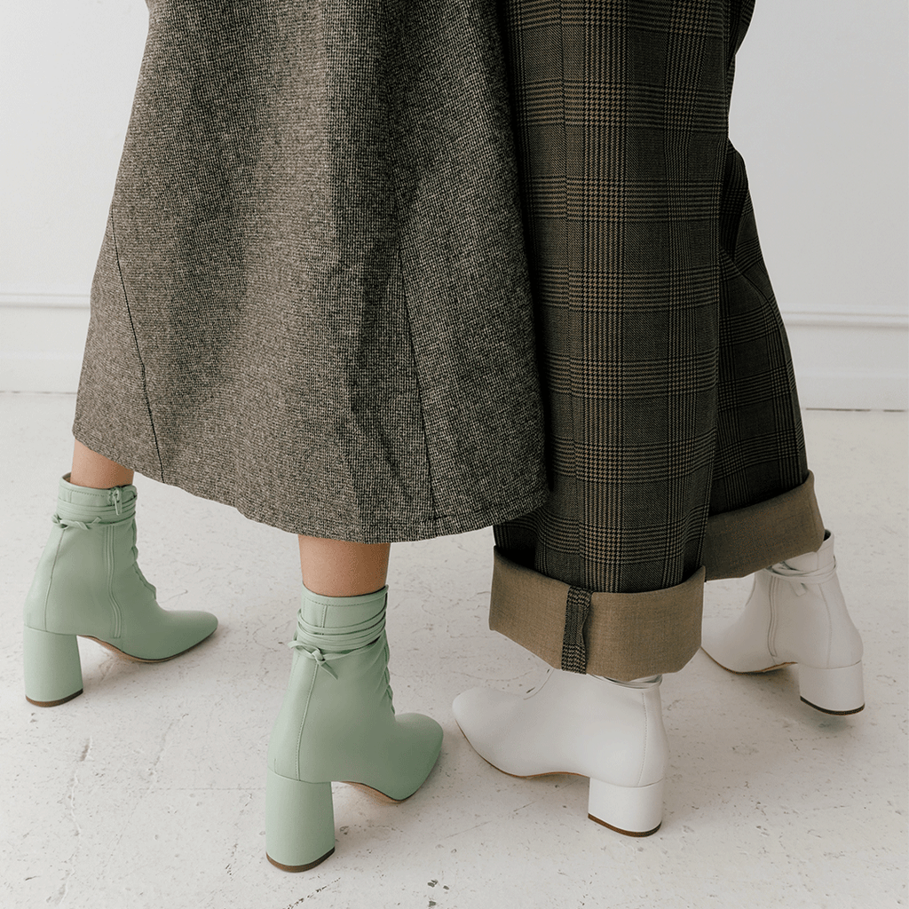 Daniella Shevel Belladonna Mint Green Lace Up Boot styled in brown skirt and brown pants