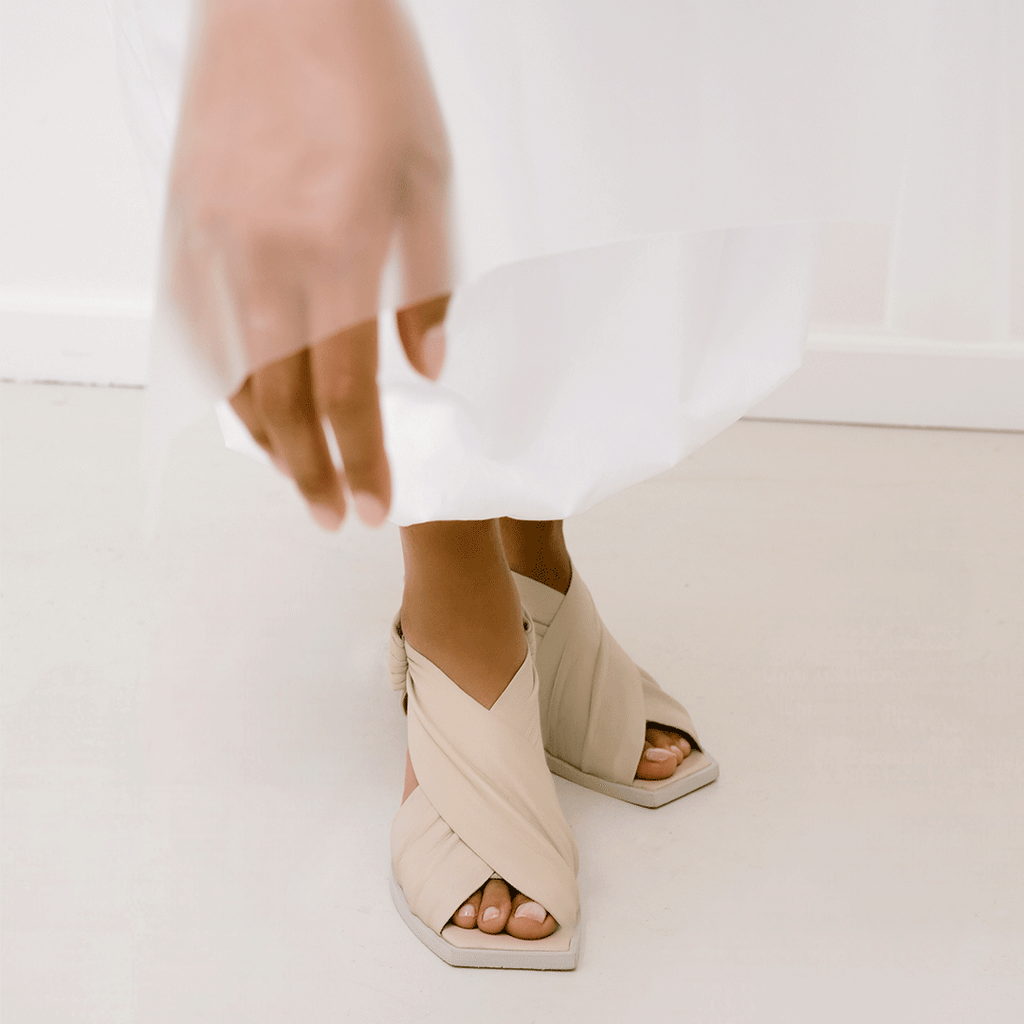 Daniella Shevel Harper in stone white wrap leather sandal with square toe front view