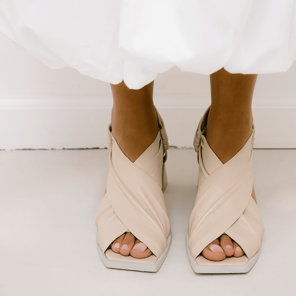 Daniella Shevel Harper in stone white wrap leather sandal with square toe front close up details