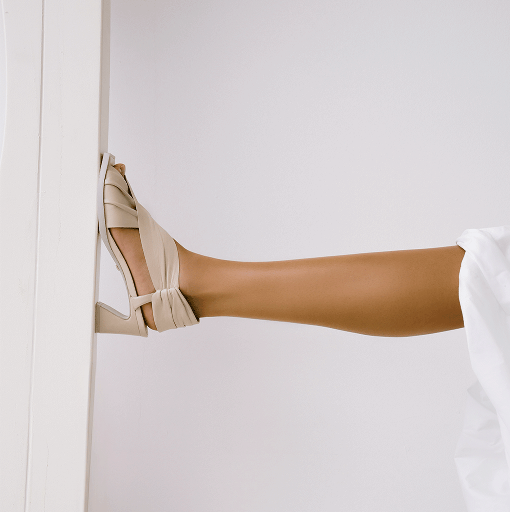 Daniella Shevel Harper in stone white wrap leather sandal with square toe side detail view
