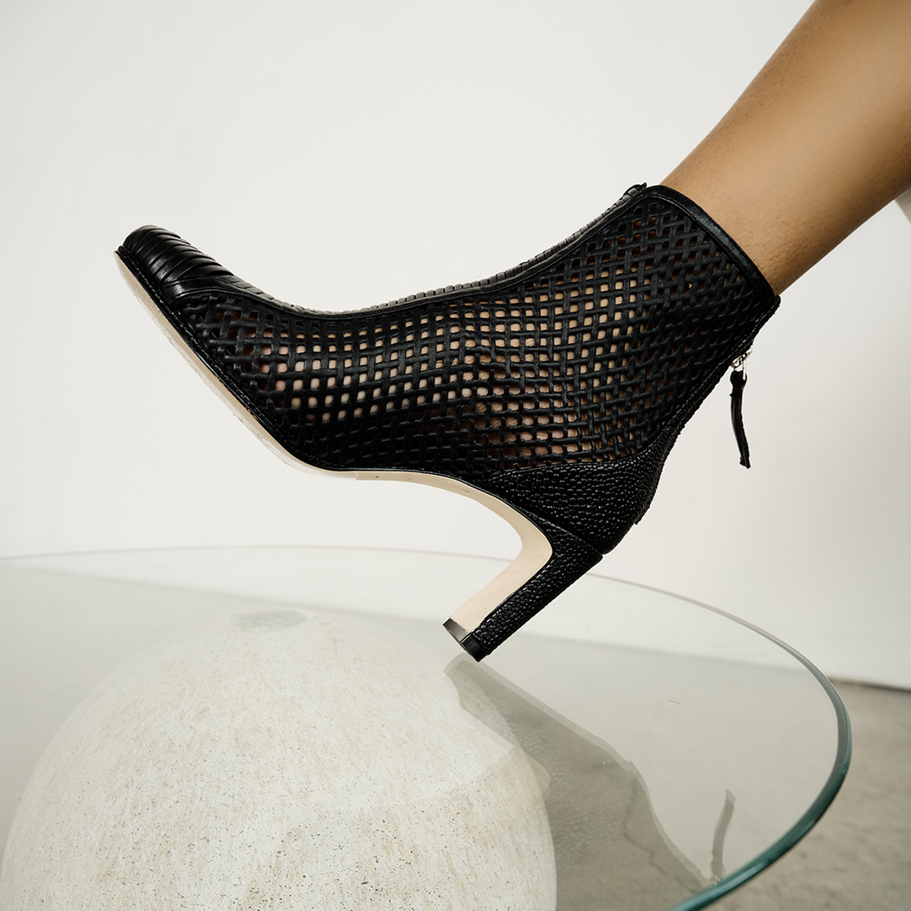 Daniella Shevel Isabella Low heel Bootie in black on model with Dress