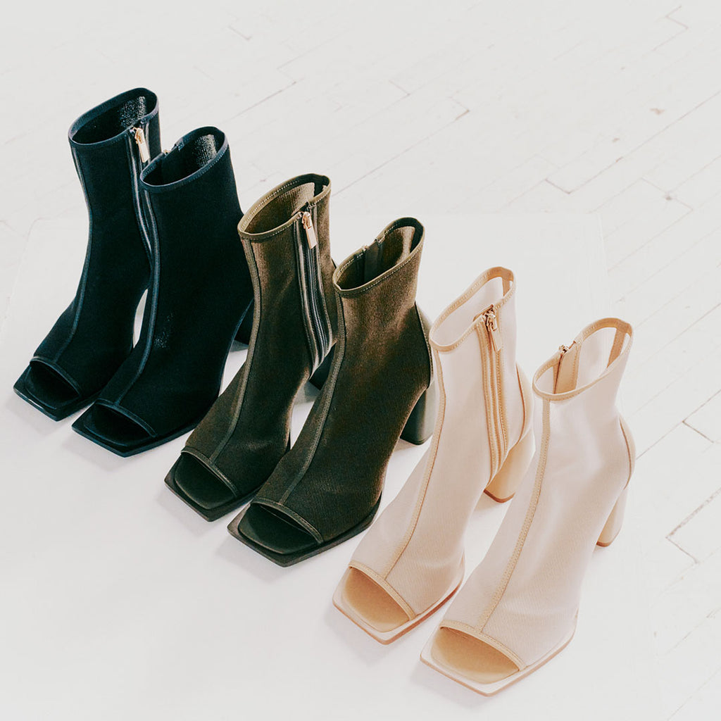 Daniella Shevel Onyx open-toe boots in mesh and leather, displayed in camel, black, and olive, offering versatile styling options.