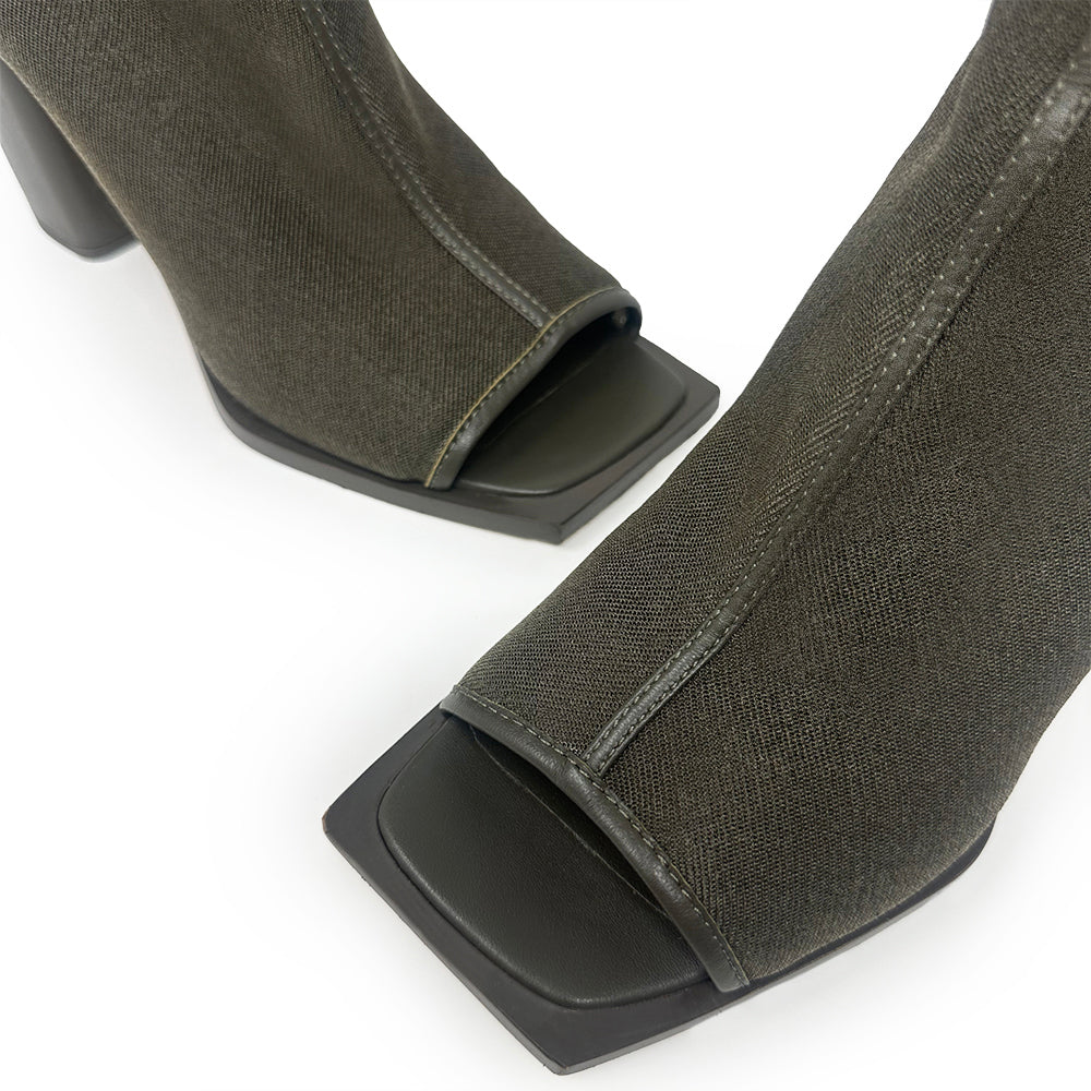 Daniella Shevel Onyx olive ankle boots, showcasing their mesh upper, breathable design, and luxurious leather craftsmanship. Detail of squared-toe.