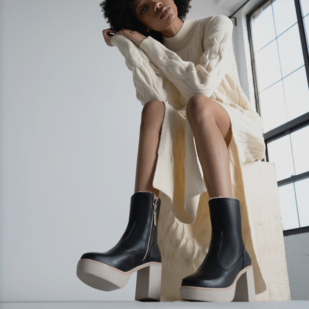 Daniella Shevel Aspen Shearling Boot in black waterproof and weatherproof with rubber lugg sole with cashmere dress