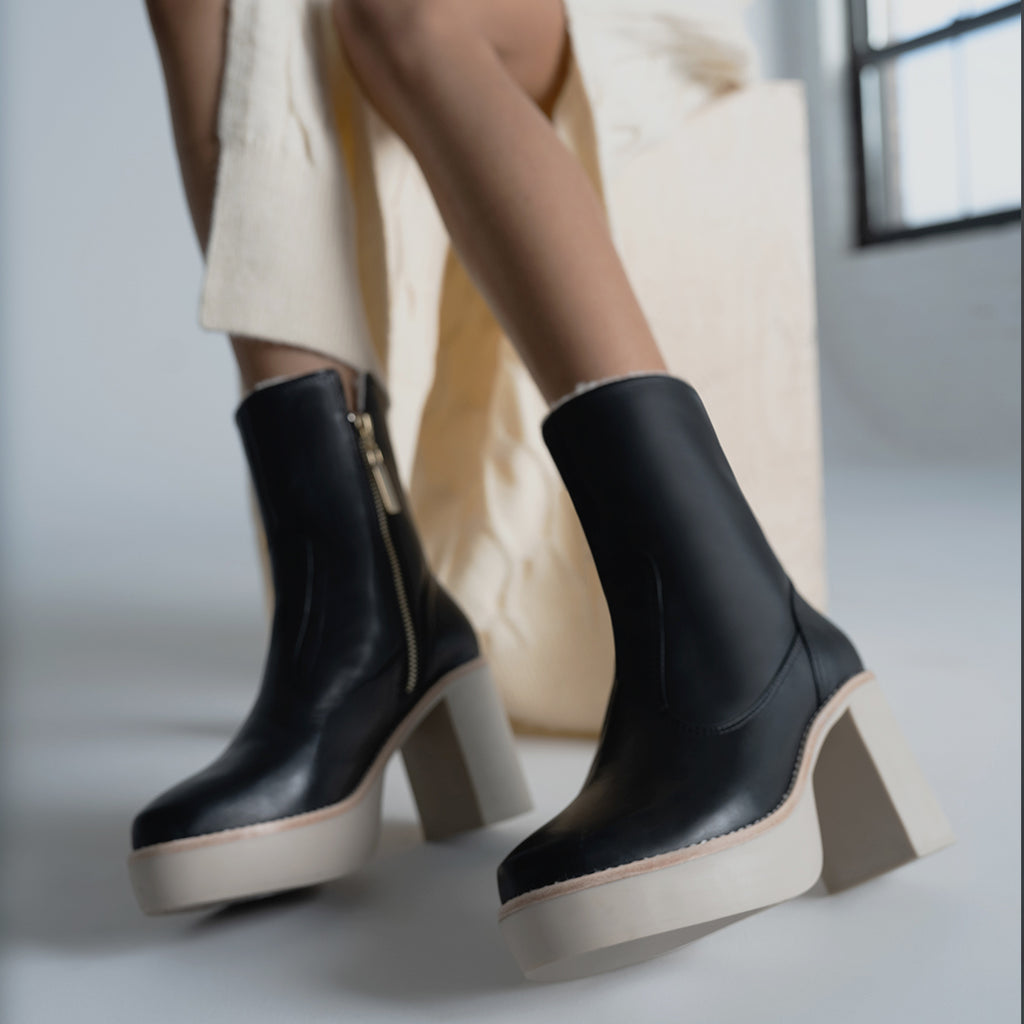Daniella Shevel Aspen Shearling Boot in black waterproof and weatherproof with rubber lugg sole close up on model