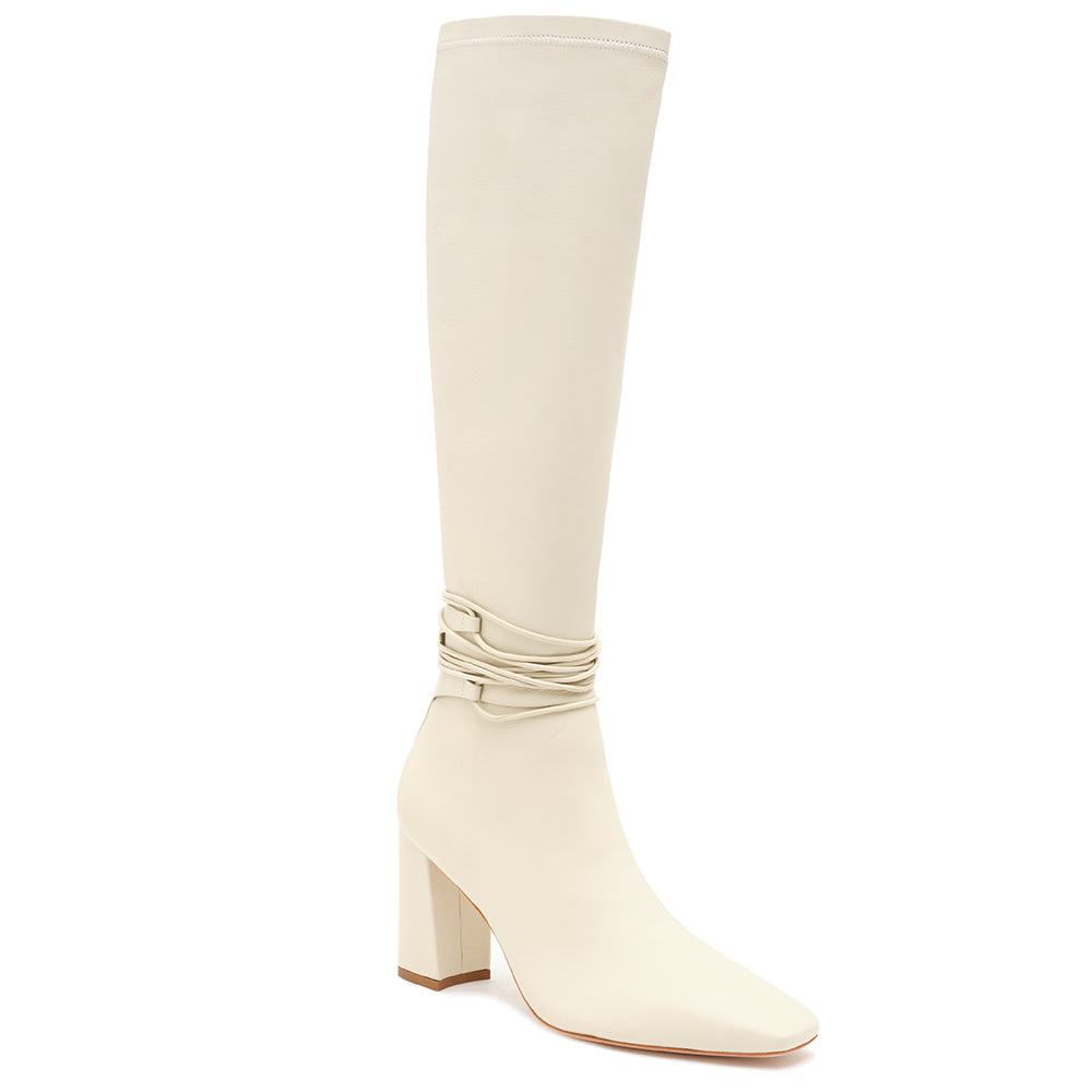 Daniella Shevel Cream Blonde Tall Shaft Boot in Leather stretch side angle view with laces