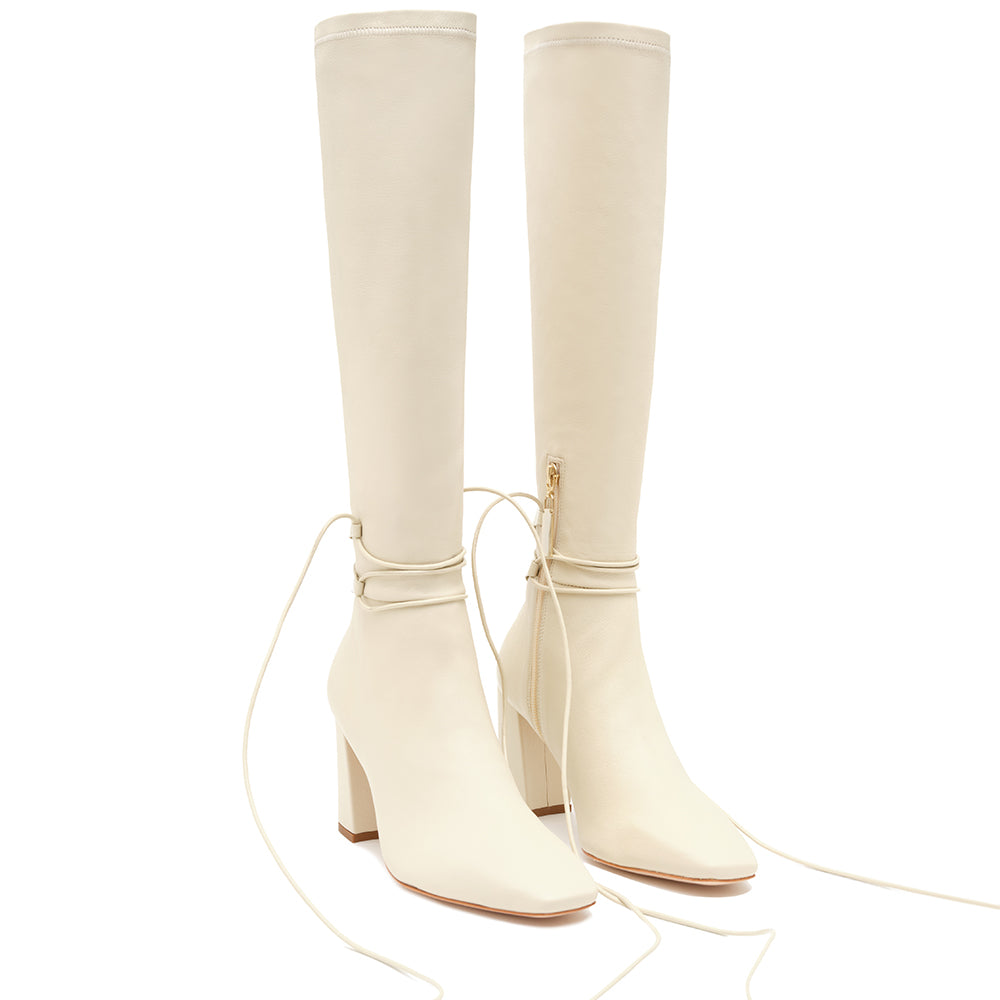 Daniella Shevel Cream Blonde Tall Shaft Boot in Leather stretch side view with laces untied