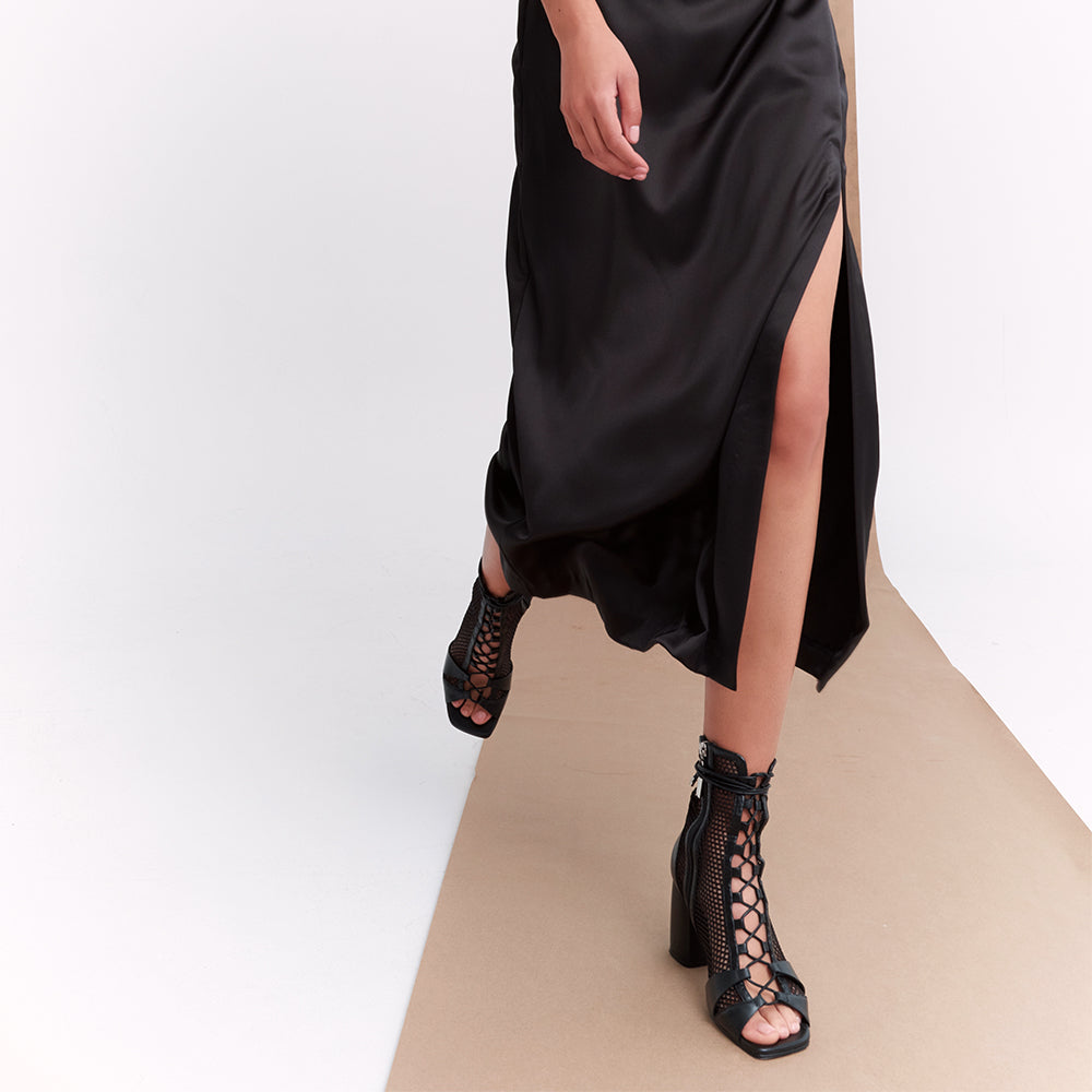 Daniella Shevel Romi Mesh Lace Up Heel with black corset dress walking on model
