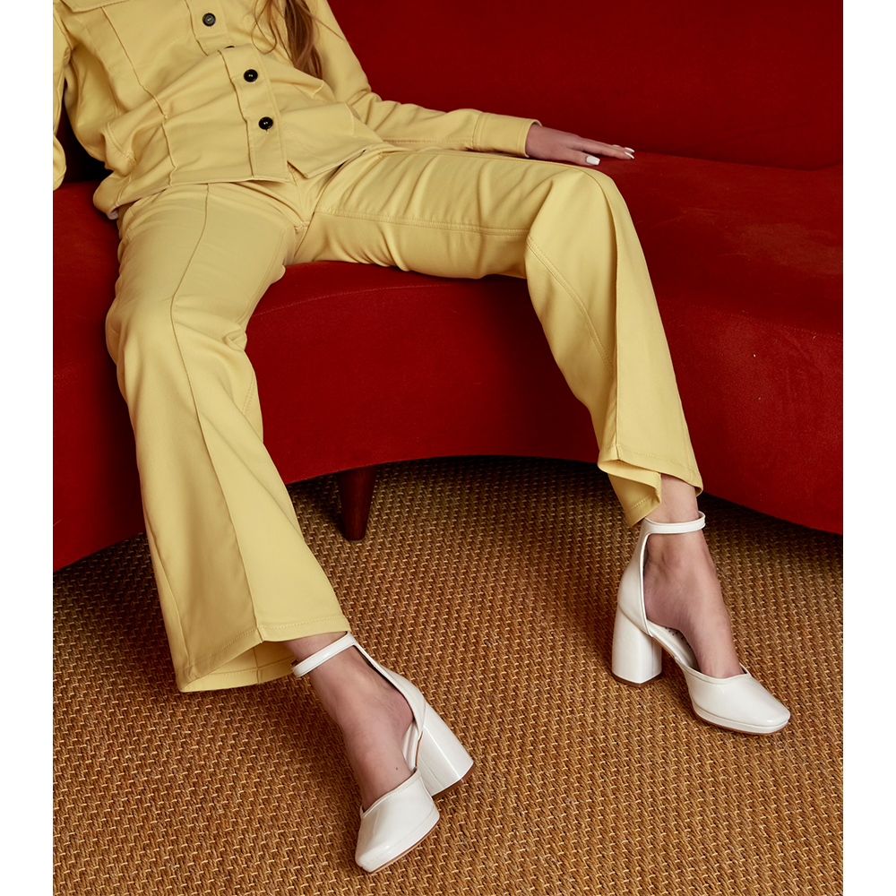 Daniella Shevel White Retro Lady Pumps with Yellow suit on retro sofa